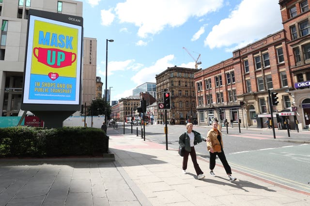 A billboard in Manchester promoting the guidelines on wearing masks (Peter Byrne/PA)