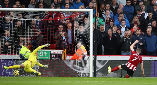 John Lundstram, right, scores Sheffield United’s second goal