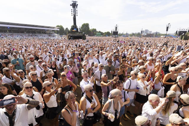 People wearing bald caps at BST Hyde Park