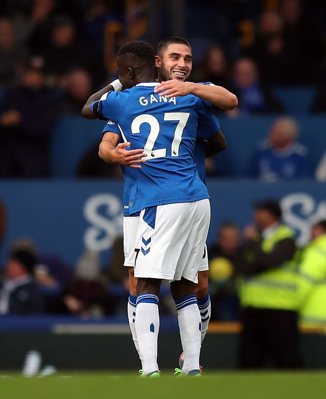 Neal Maupay, right, celebrates his goal with Idrissa Gana Gueye