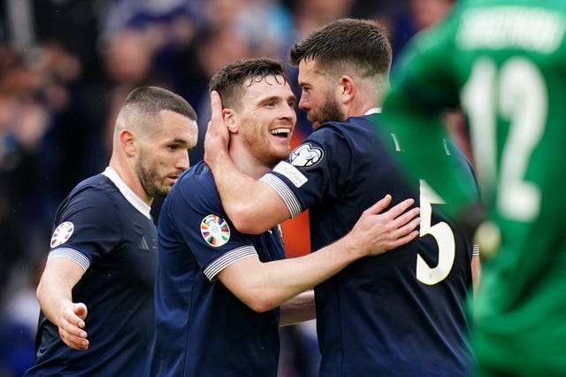 Scotland’s John McGinn, Andrew Robertson and Grant Hanley celebrate