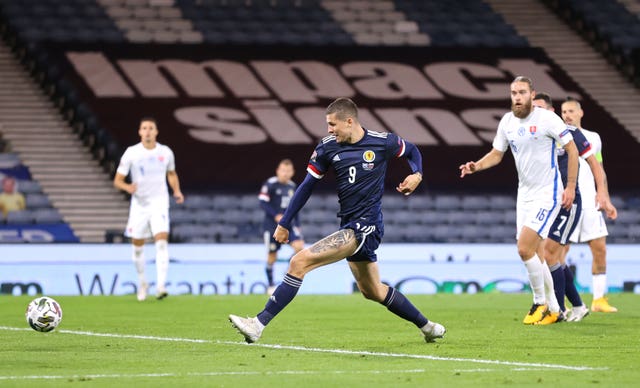 Lyndon Dykes scores the winner against Slovakia