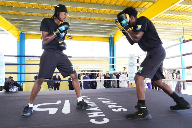 The King watching a youth boxing session during a visit to the Bahamas Boxing Academy in Nassau