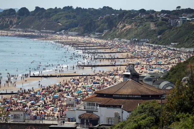 People crowd on the beach in Bournemouth, Dorset, in June
