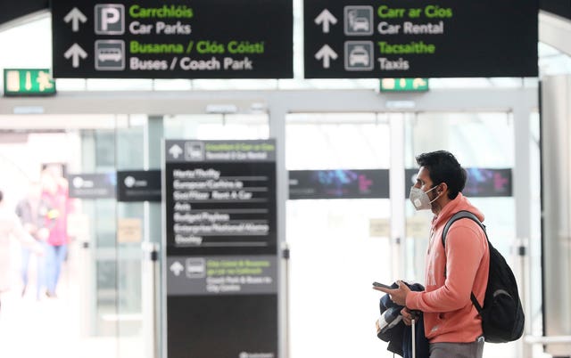 Man wearing a face mask at an airport