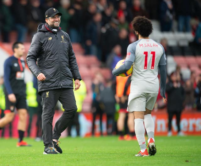 Jurgen Klopp, left, congratulates Mohamed Salah after the game