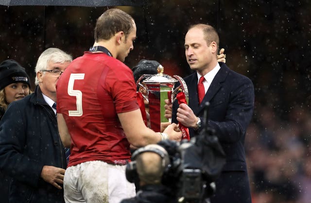 Wales’ Alun Wyn Jones is presented with the trophy