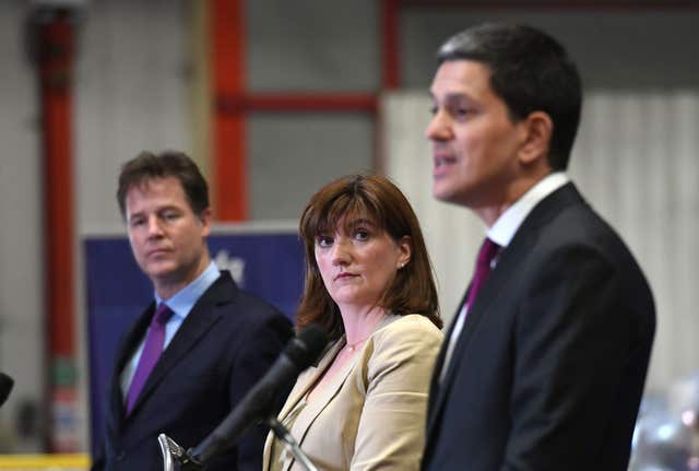 Mr Miliband, right, shares a cross-party platform with Sir Nick Clegg and Nicky Morgan (Stefan Rousseau/PA)