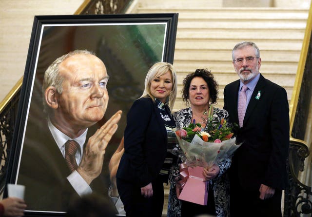 Sinn fein deputy leader Michelle O’Neill (left) and former Sinn Fein leader Gerry Adams with Bernadette McGuinness wife of ex-deputy first minister Martin McGuinness at the unveiling of his portrait (Brian Lawless/PA)