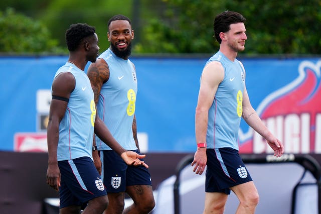 Bukayo Saka (left) Ivan Toney and Declan Rice (right) during a training session