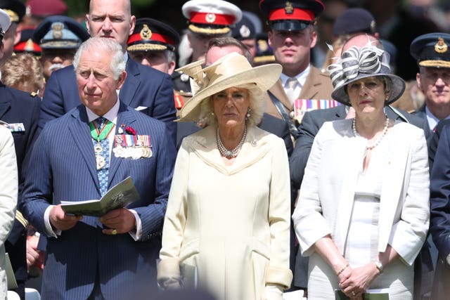 Charles, Camilla and Theresa May in Bayeux