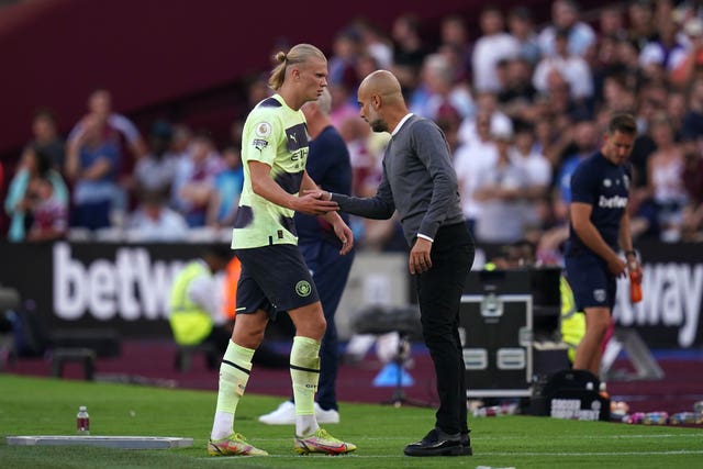 Guardiola (right) hopes Haaland (left) can remain level-headed