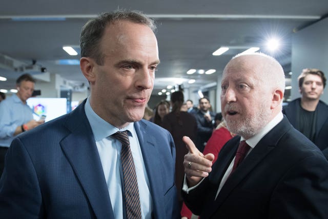 Dominic Raab walks away from Andy McDonald