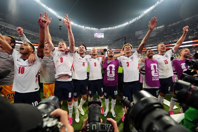 England’s players celebrate in front of supporters at full-time (Nick Potts/PA)