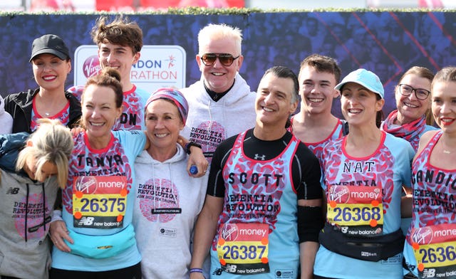 DJ Chris Evans, centre, and members of the Eastenders cast posed for photographs