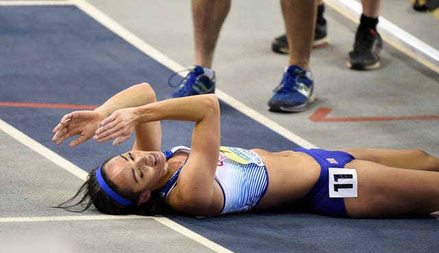 Katarina Johnson-Thompson collapses to the floor after sealing gold in the pentathlon 