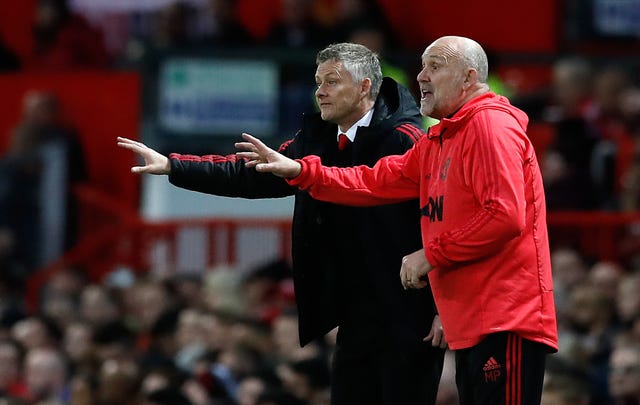 Ole Gunnar Solskjaer, left, and assistant Mike Phelan will remain at Old Trafford (Martin Rickett/PA)