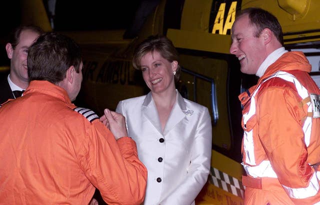 The Earl (partially concealed left) and Countess of Wessex at a TVAA fundraising dinner with helicopter pilot Andy Busby (left) and paramedic Tim Goddard, part of the air ambulance crew who airlifted Sophie to hospital. Andrew Stuart/PA Wire