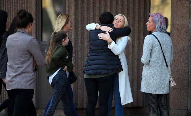 The murdered woman's sister Nadine Hayes is comforted as she arrives at Liverpool Crown Court (Peter Byrne/PA)
