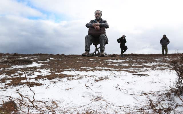 Snow settled around the Seated Man sculpture near Castleton on the North Yorkshire moors (Owen Humphreys/PA)