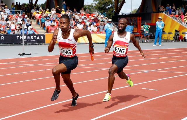 England’s Zharnel Hughes (left) and Reuben Arthur (right) compete in a men’s 4 x 100m relay heat at the Carrara Stadium