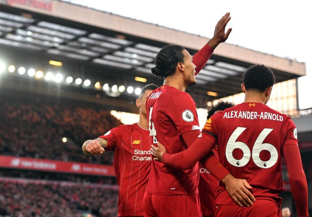 Virgil Van Dijk celebrates scoring his second 