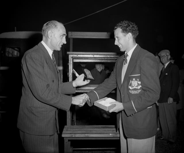 John Landy, right, threatened to become the first man to break the four-minute mile barrier on several occasions