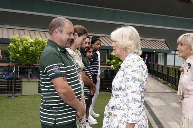 The Queen with Will Brierley, lead groundsperson, who has dedicated 20 years of service to the Club, at the All England Lawn Tennis and Croquet Club on day 10 of the 2025 Wimbledon Championships