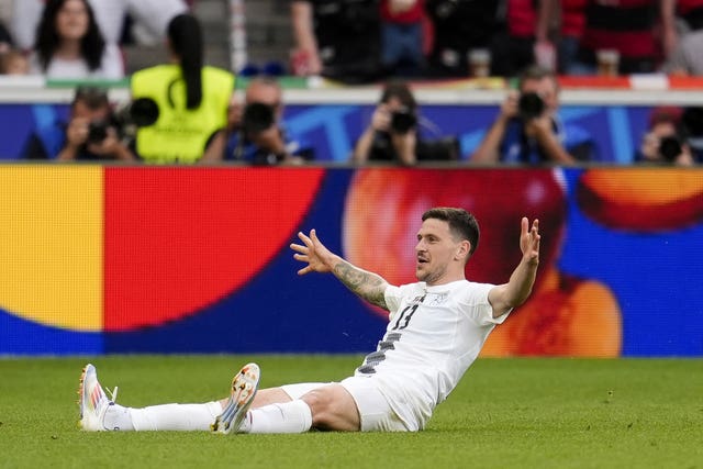 Erik Janza celebrates after scoring Slovenia''s equaliser