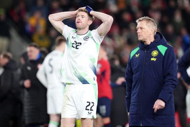 Nathan Collins (left) and head coach Heimir Hallgrimsson appear dejected following the penalty shoot-out defeat