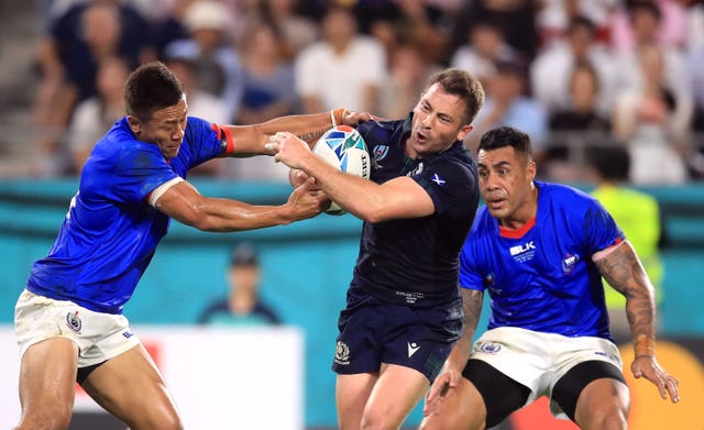 Laidlaw breaks through a tackle on the way to scoring a try