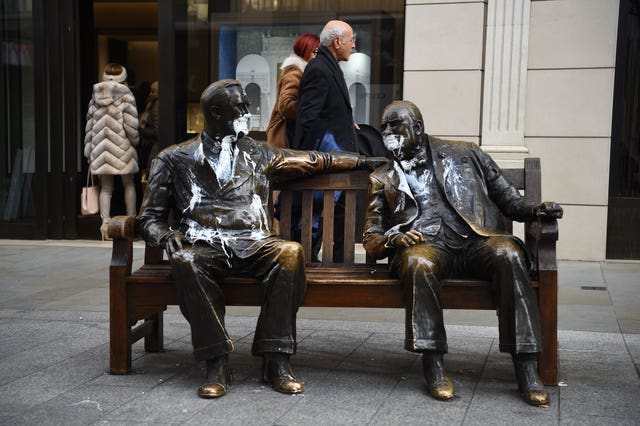 The figures of Franklin D Roosevelt and Winston Churchill on the Allies sculpture in New Bond Street, London, which has been vandalised with white paint