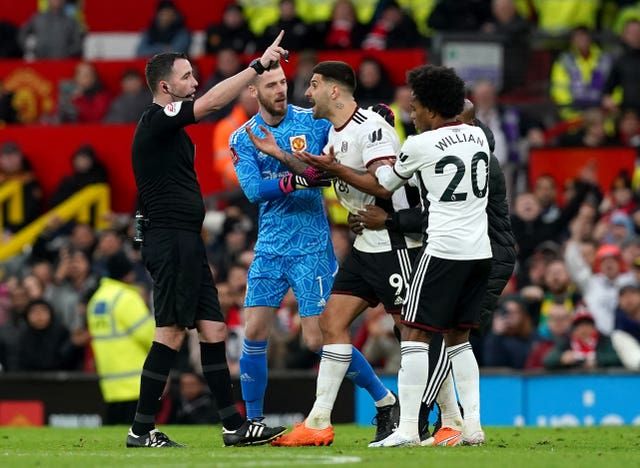Aleksandar Mitrovic (centre) is sent off