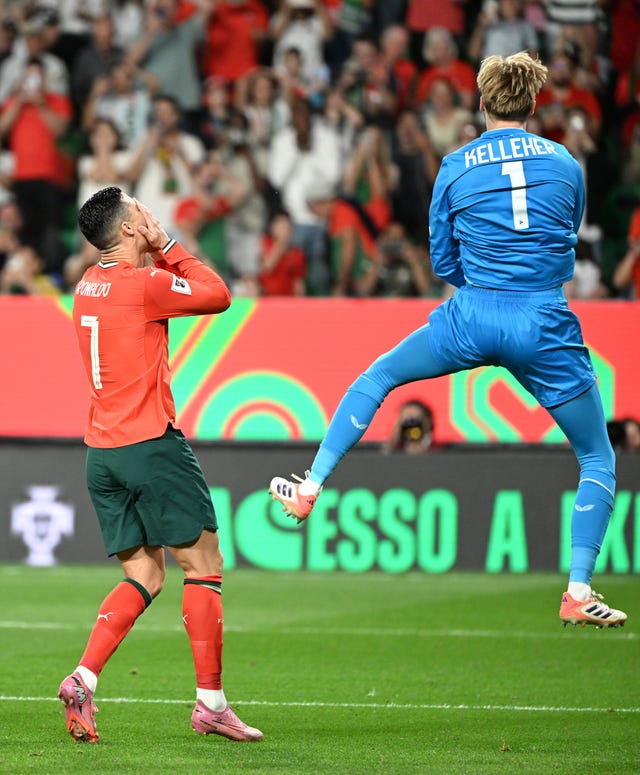 Portugal’s Cristiano Ronaldo reacts after seeing his penalty kick saved by Republic of Ireland goalkeeper Caoimhin Kelleher (right)