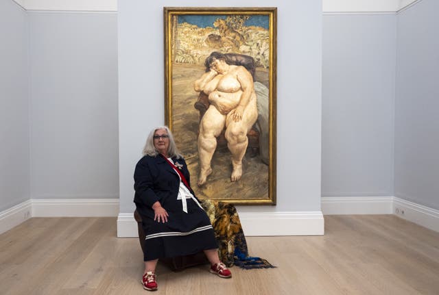 Sue Tilley in front of Sleeping By The Lion Carpet