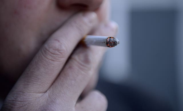 ile photo dated 12/03/13 of a man smoking a cigarette