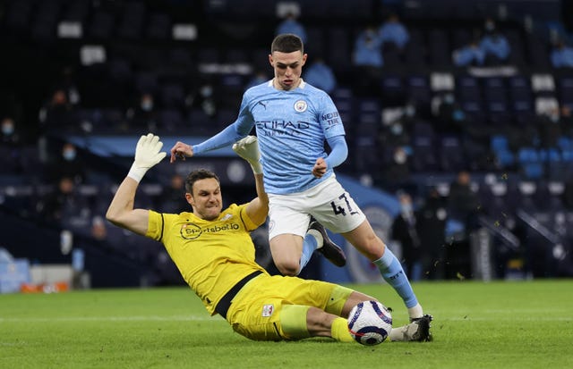 Alex McCarthy tackles Phil Foden