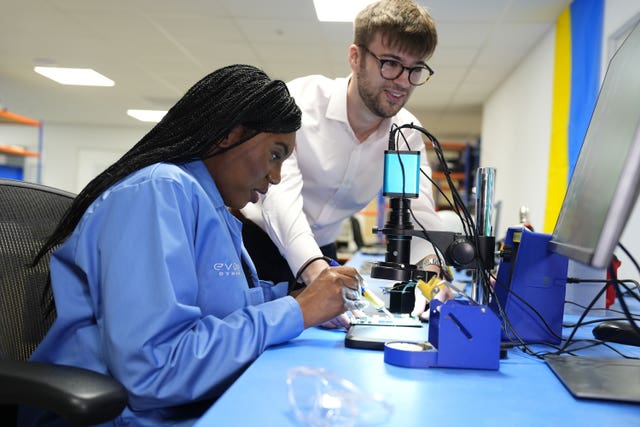 Conservative Party leader Kemi Badenoch solders a circuit board