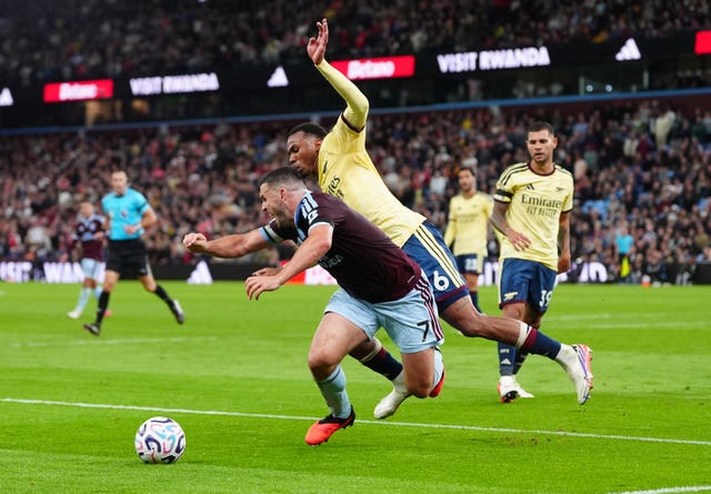 Aston Villa’s John McGinn and Arsenal’s Gabriel battle for the ball