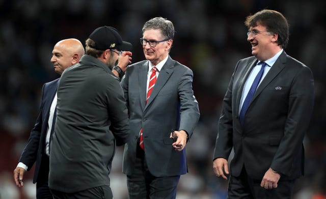 Liverpool manager Jurgen Klopp (left) shakes hands with club owner John W. Henry after winning the Champions League Final 