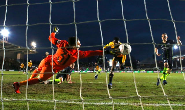 Ederson makes a stunning save to stop Tyreeq Bakinson giving Newport the lead