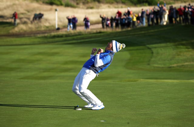 Suzann Pettersen celebrates her putt on the 18th to win the Solheim Cup for Team Europe