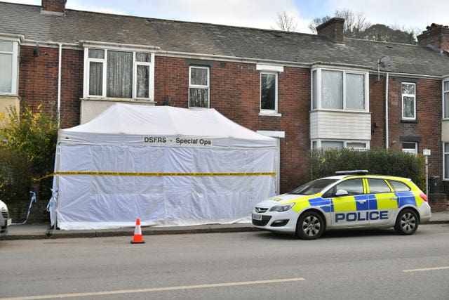 The scene outside 65 Bonhay Road, Exeter, where the body of Anthony Payne, 80, was discovered