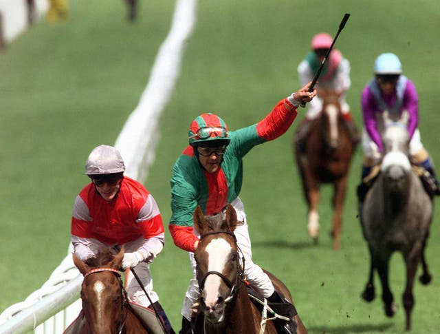 Darryll Holland celebrates after Double Trigger wins his third Goodwood Cup