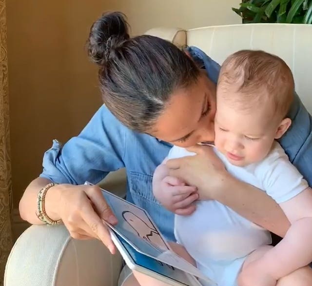 Meghan gives her son a kiss