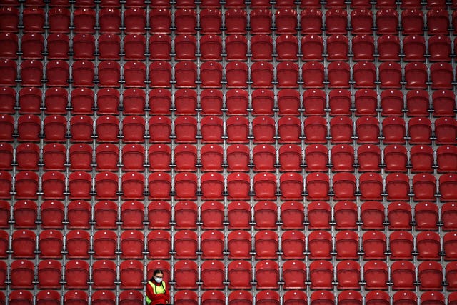 A ball girl sits alone in the stands during Rotherham's home Sky Bet Championship match against Coventry