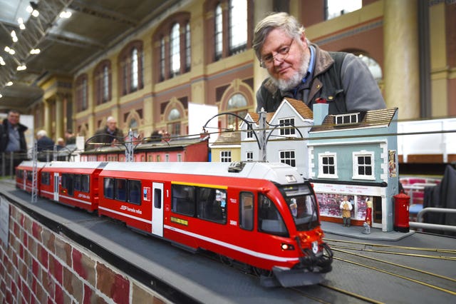 Model engineer Alan Pearce, watches a train