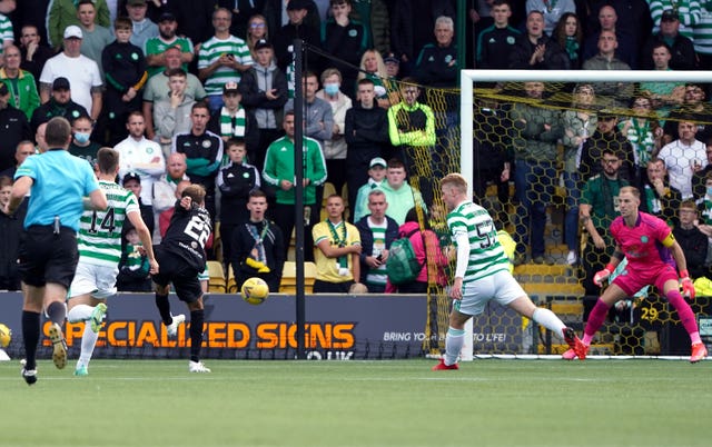 Livingston's Andrew Shinnie scores the only goal of the game against Celtic in the cinch Premiership