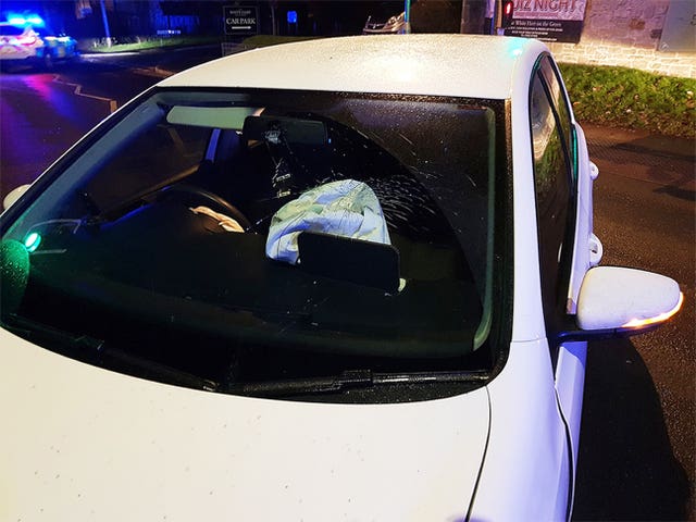 A white Volkswagen Golf which had crashed into a set of traffic lights in Crowborough, East Sussex