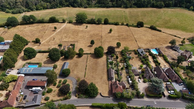A view of the parched fields surrounding Tilford Village in Surrey